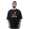 Un individuo con barba que viste Chernobil / Disney - Camiseta Oversized fusiona sin esfuerzo elementos de estilos de anime en una apariencia moderna mientras se encuentra de pie sobre un fondo blanco liso.